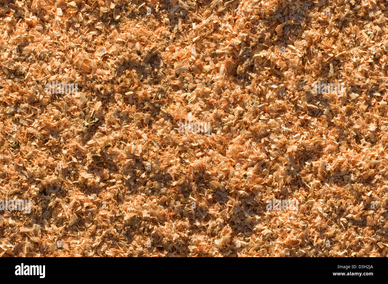 Sunlit sawdust background seamlessly tileable Stock Photo