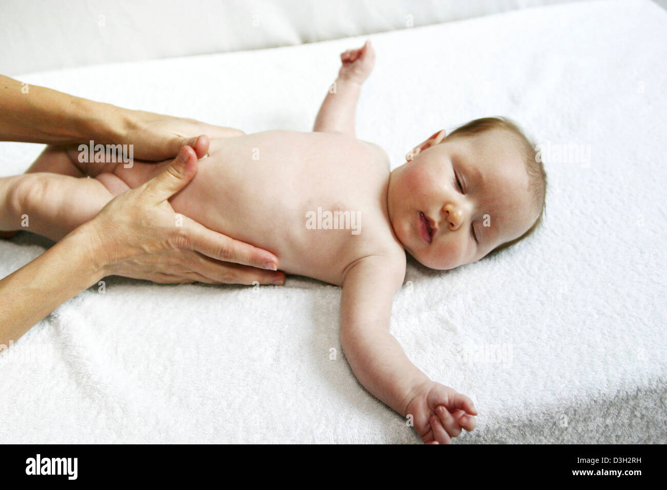 INFANT BEING MASSAGED Stock Photo