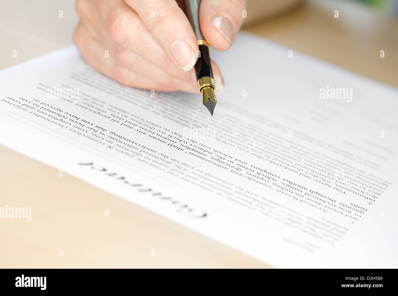 Signing a Contract with Fountain Pen Stock Photo