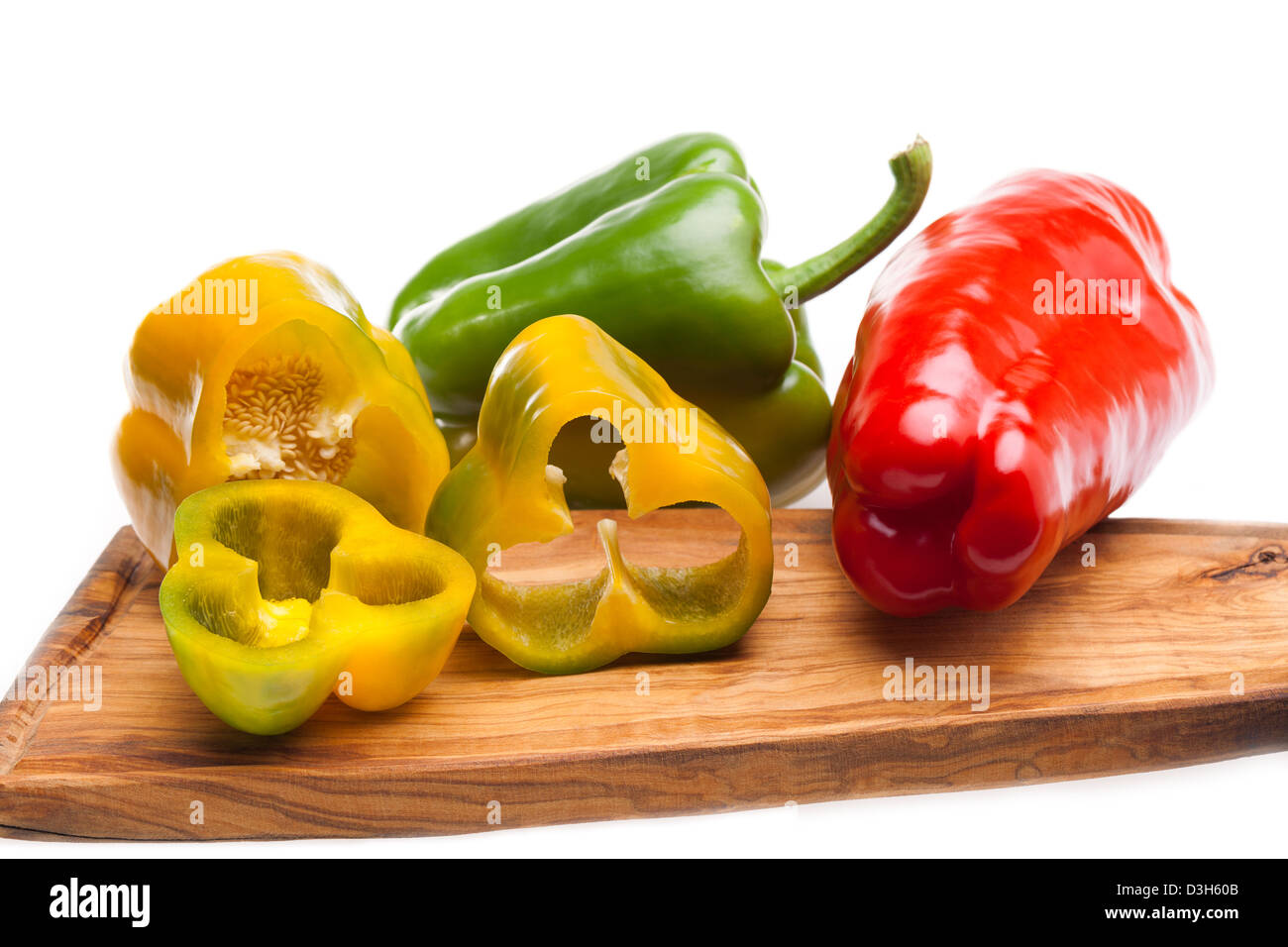 Peppers On Chopping Board Stock Photo - Alamy