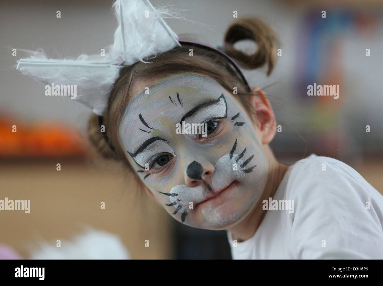 Portrait of a 5 year old girl dressed and face painted as a mouse during a carnival party in the kindergarten. Leipzig, Germany. Stock Photo