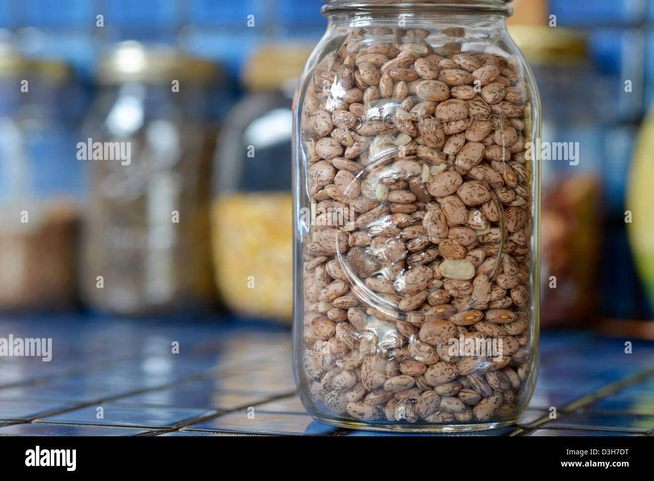 Jar of dried pinto beans on the kitchen counter of a house in Joseph, Oregon. Stock Photo