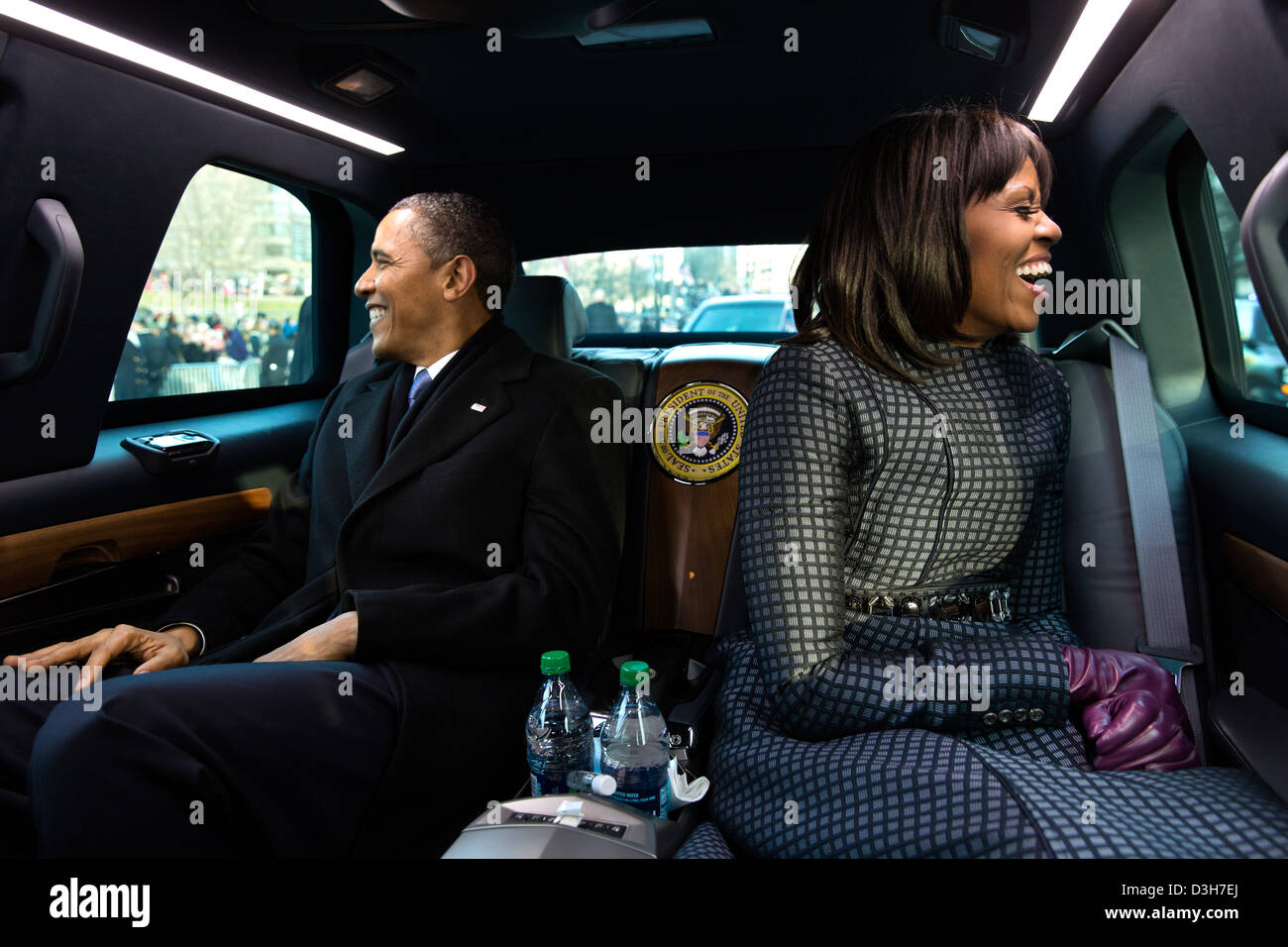 US President Barack Obama and First Lady Michelle Obama ride in the inaugural parade January 21, 2013 in Washington, DC. Stock Photo