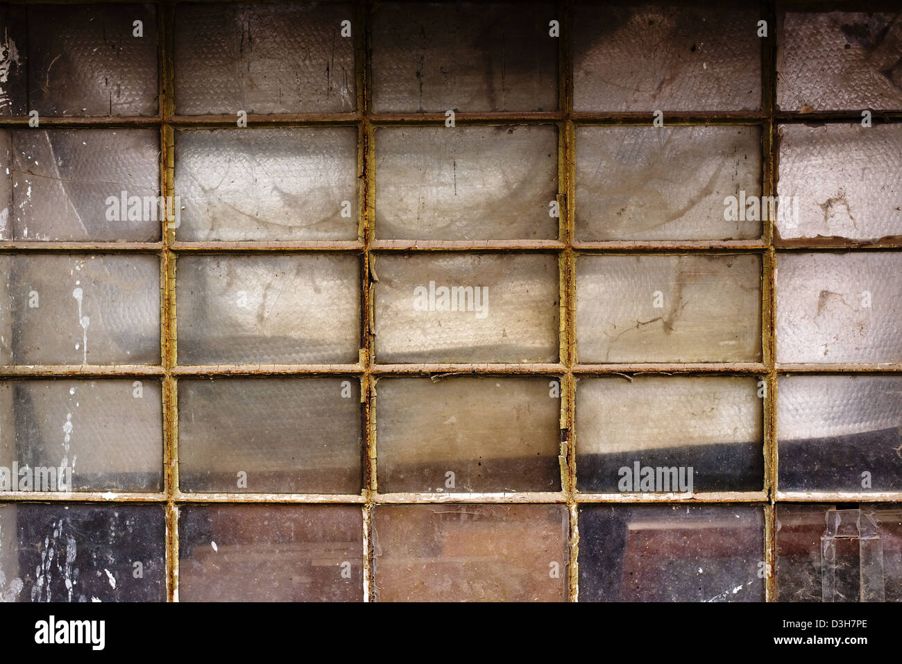 Old metal shed window with dirty obsolete glass. Stock Photo