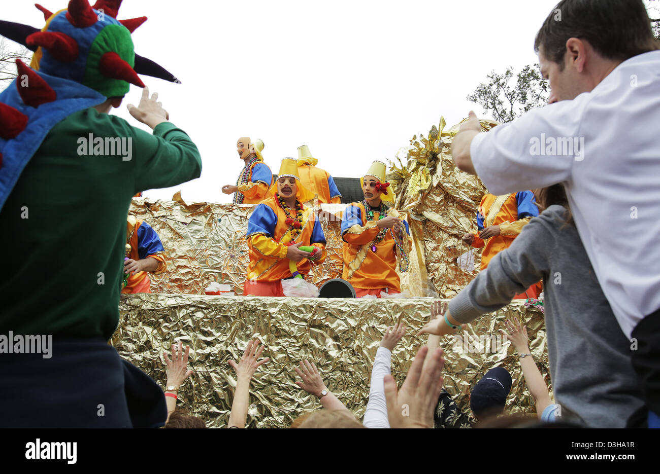 Feb. 10, 2013 - New Orleans, LOUISIANA, UNITED STATES - A masked float rider throws beads to the cheering crowd as the Krewe of Okeanos Parade rolls through the streets in New Orleans, Louisiana USA on February 10, 2013. Mardi Gras festivities will be happening all weekend long culminating with Fat Tuesday on February 12, 2013. (Credit Image: © Dan Anderson/ZUMAPRESS.com) Stock Photo