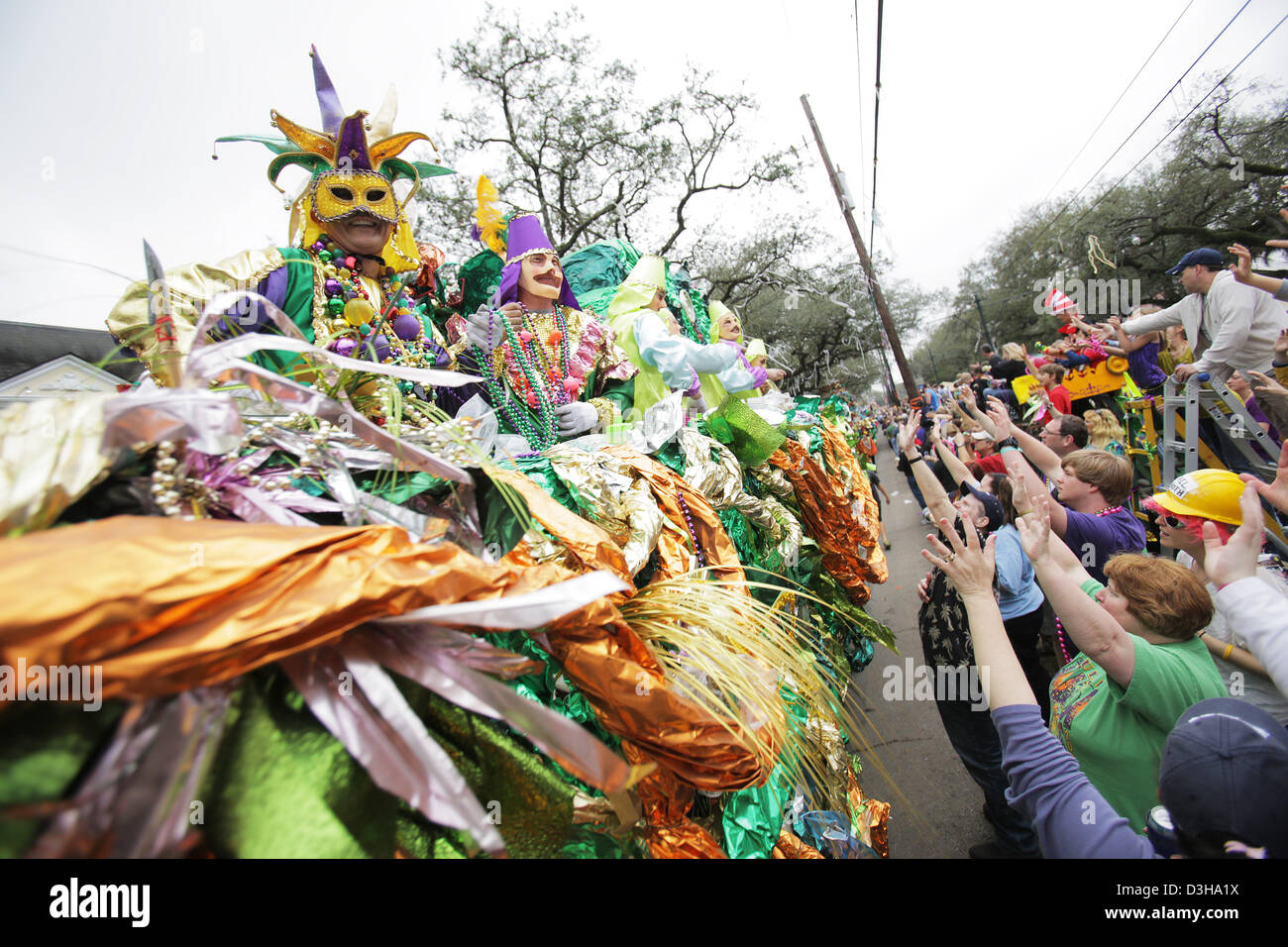 Feb. 10, 2013 - New Orleans, LOUISIANA, UNITED STATES - People cheer as a float in the Krewe of Okeanos Parade rolls through the streets in New Orleans, Louisiana USA on February 10, 2013. Mardi Gras festivities will be happening all weekend long culminating with Fat Tuesday on February 12, 2013. (Credit Image: © Dan Anderson/ZUMAPRESS.com) Stock Photo