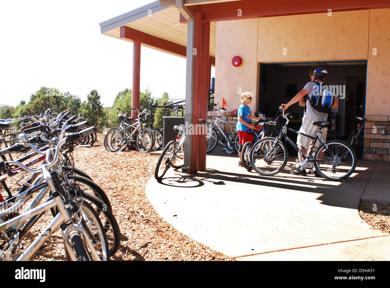 Grand Canyon National Park offers bicycle rentals at the Visitor Center for exploring the park's rim and scenic areas. It provides an alternative way for visitors to enjoy the park's natural beauty while learning about its history. Stock Photo
