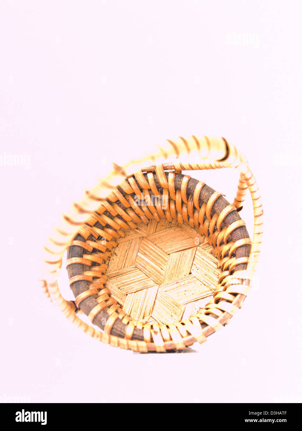 A yellow wicker basket isolated on white background Stock Photo Alamy