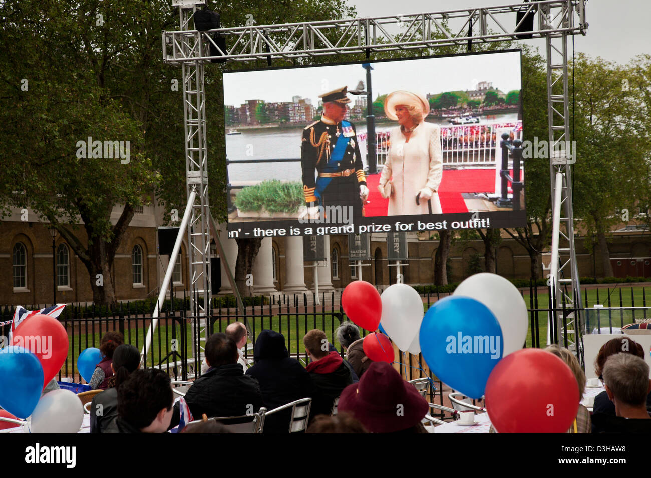 People watch Prince Charles and Camilla on large screen during the Diamond Jubilee celebrations in London, UK Stock Photo