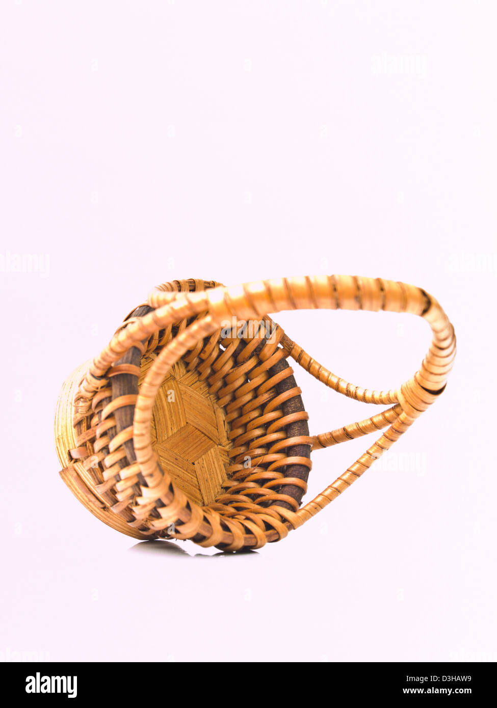 A yellow wicker basket isolated on white background Stock Photo Alamy