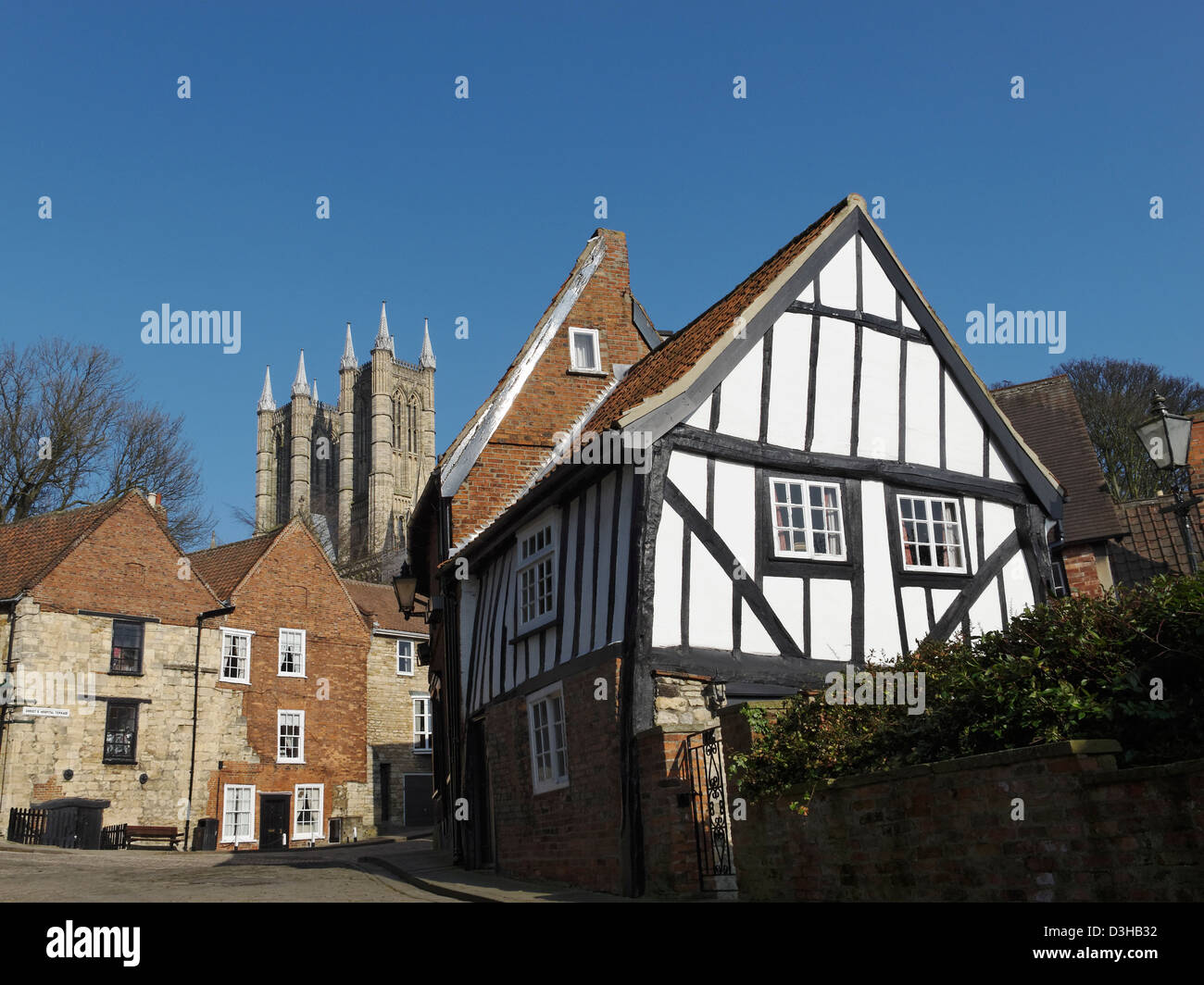 A Grade II listed cottage at Michaelgate, Lincoln, with the spires of Lincoln Cathedral in the background. Stock Photo
