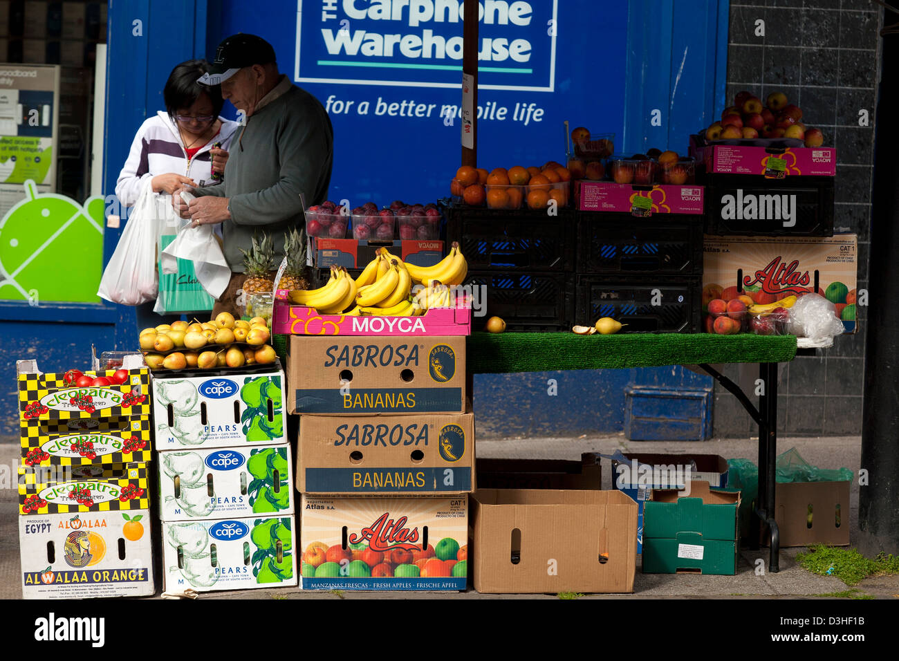 Shopping at fruit and veg shop on Byers road in Central Glasgow is a