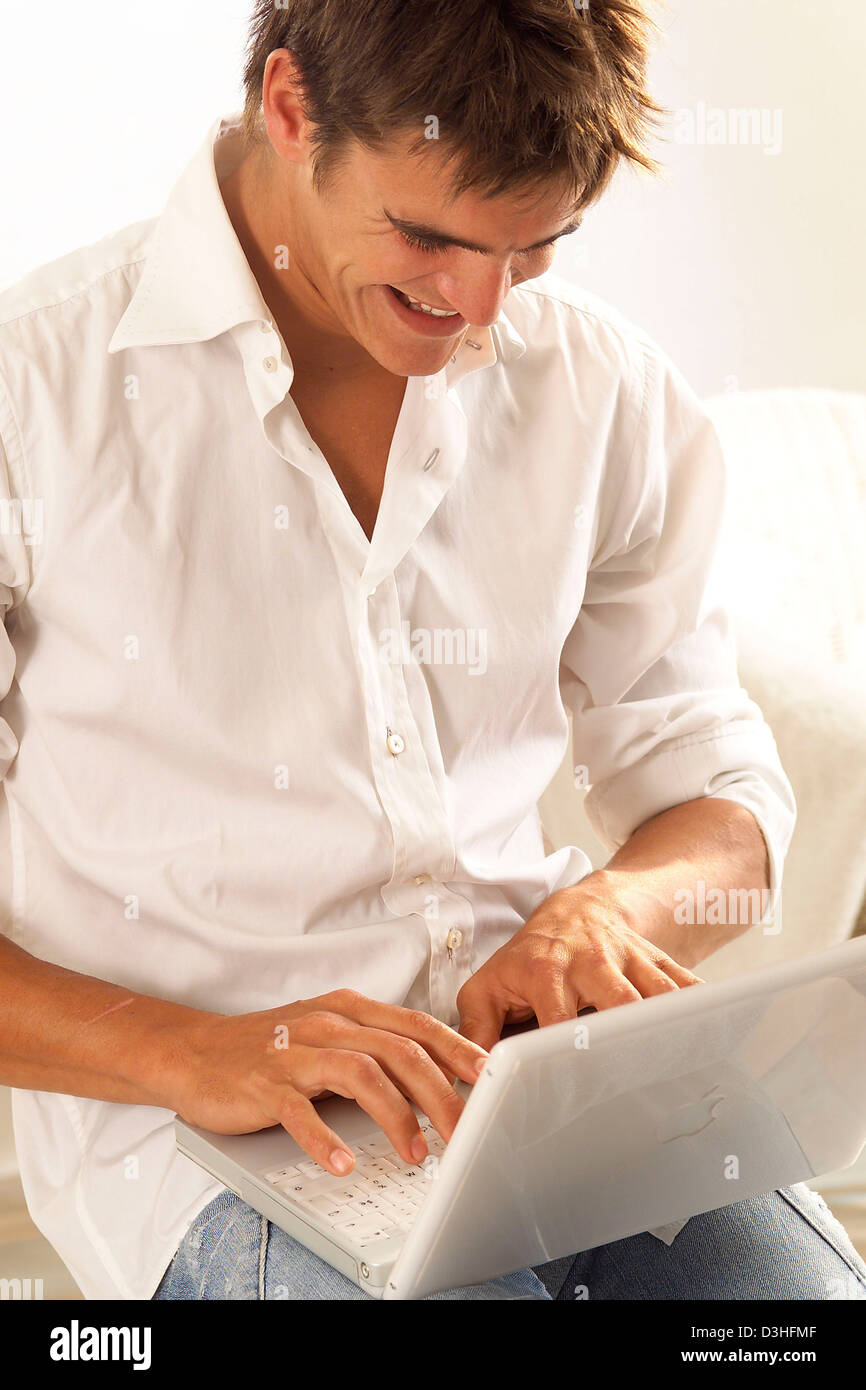 MAN USING A COMPUTER Stock Photo - Alamy