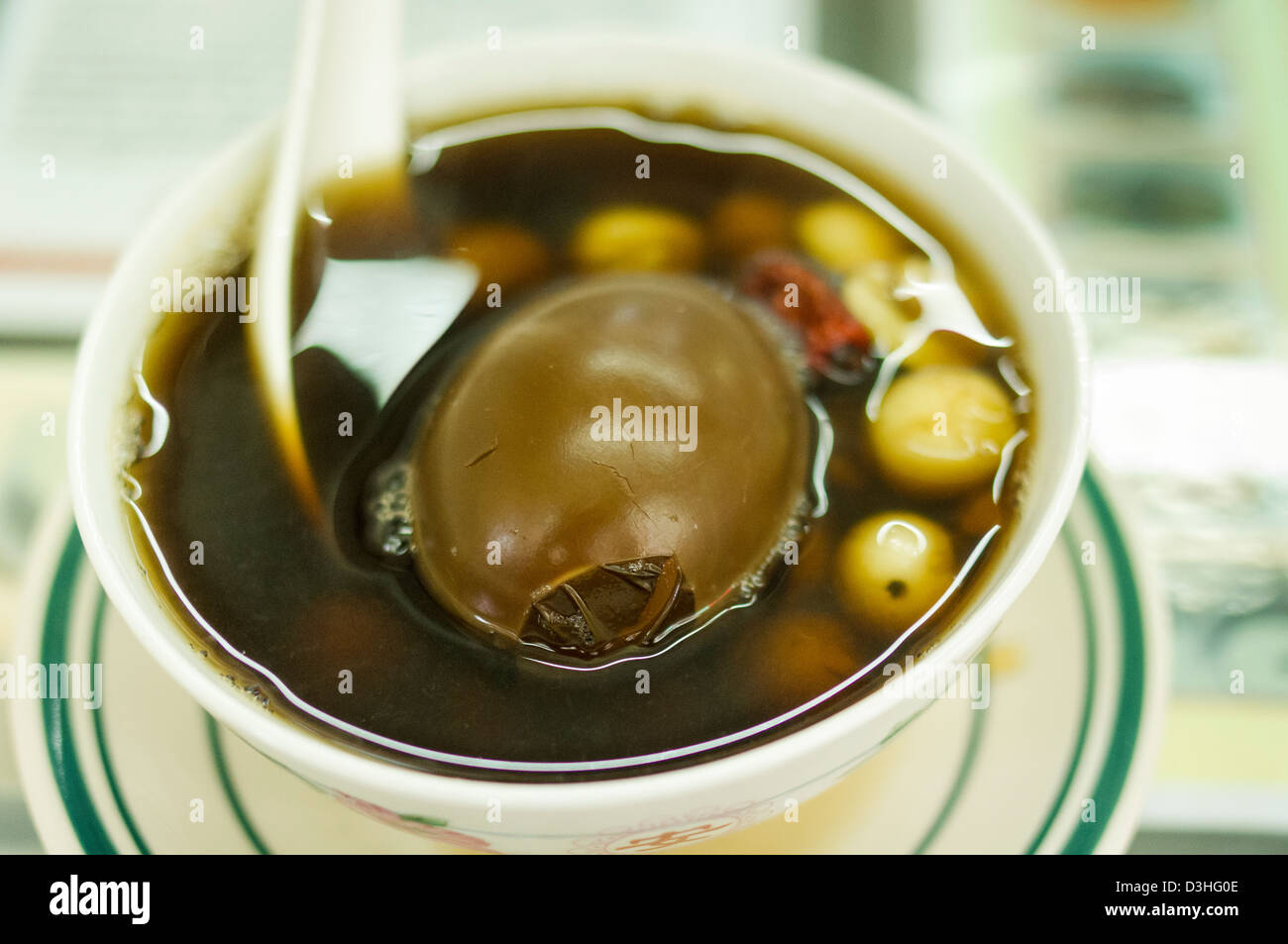 Jisheng tea with egg and lotus seeds, a kind of herbal desserts popular in Hong Kong. Stock Photo