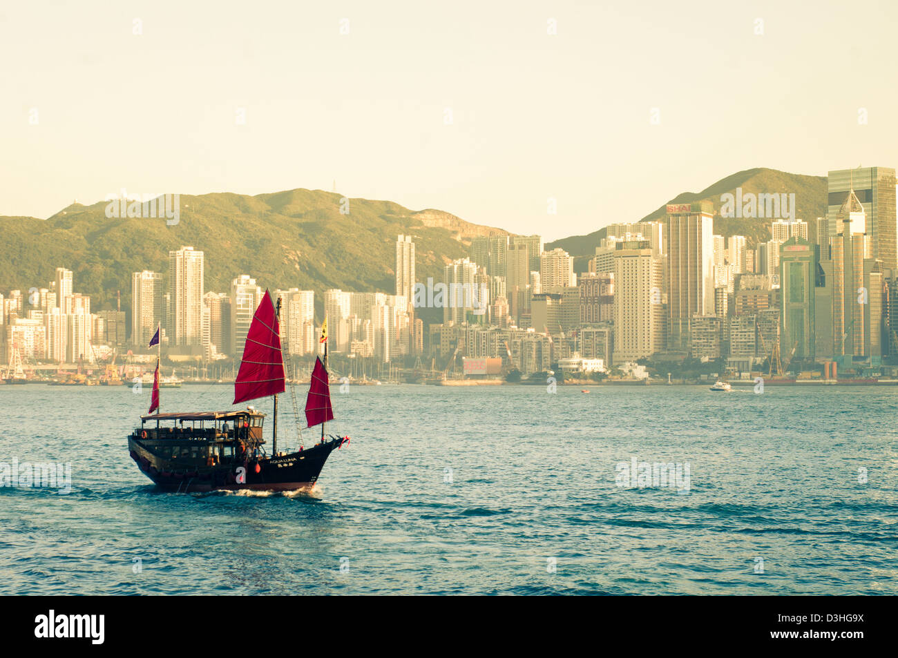 a chinese junk is sailing at victoria harbour of Hong Kong, China Stock ...