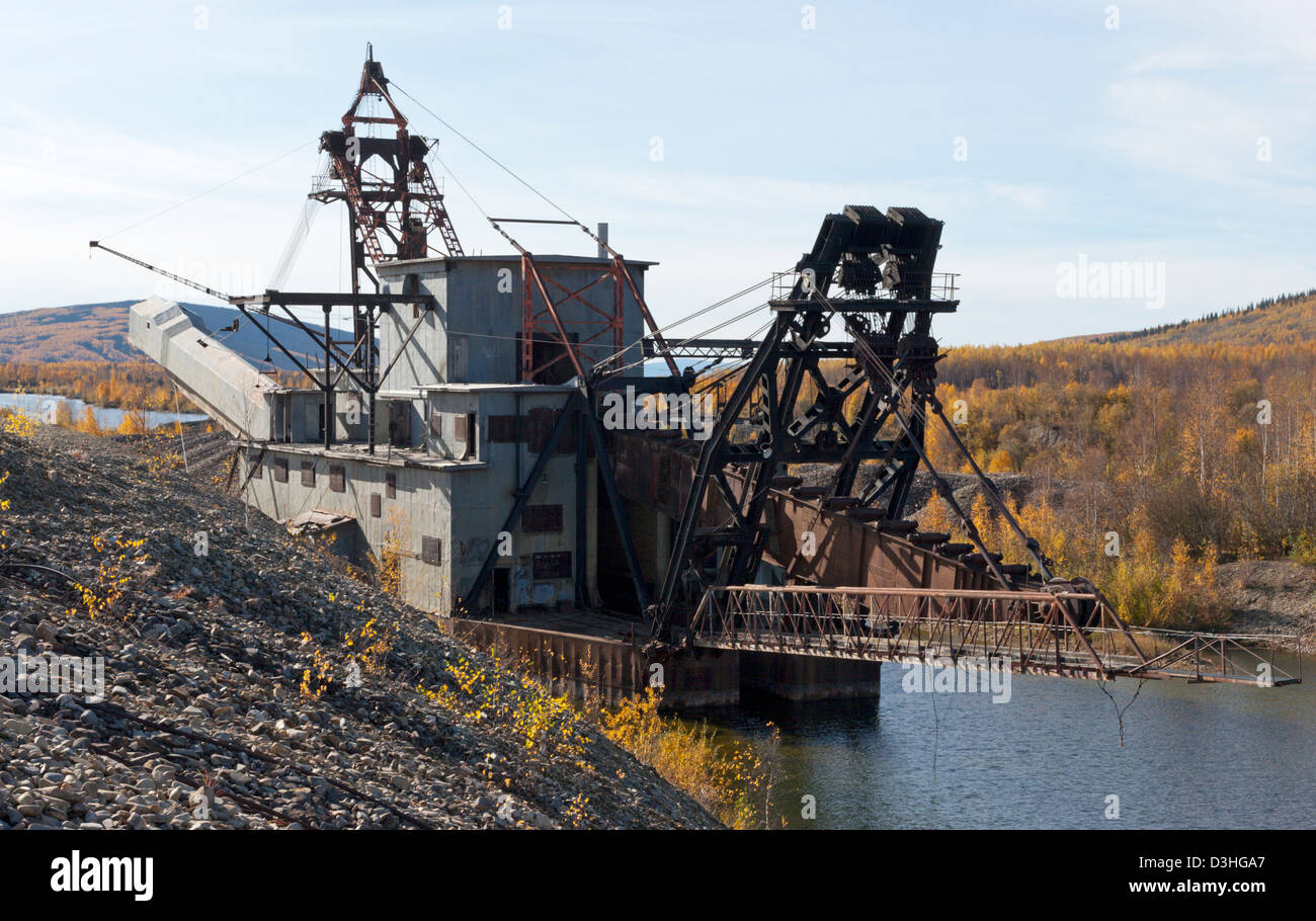 old gold dredge Fairbanks Alaska river creek gold mining Stock Photo