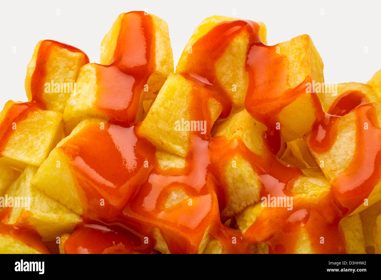 Fried potatoes with spicy sauce Stock Photo