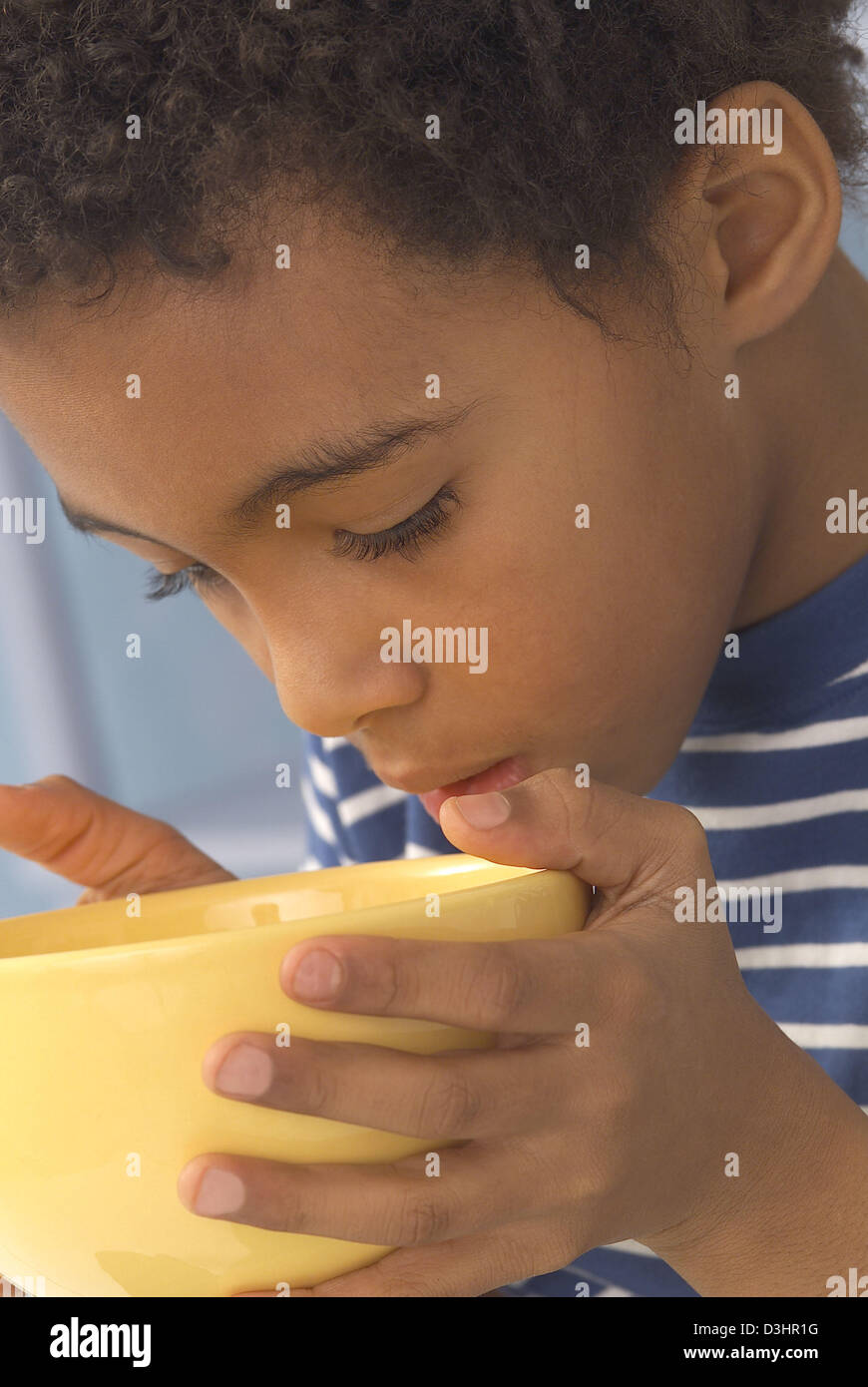 African boy eating dinner hi-res stock photography and images - Alamy