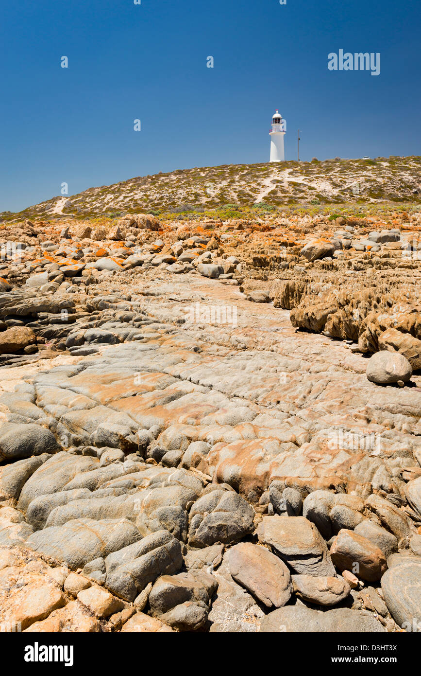 Dangerous rocks surround the lighthouse at Corny Point, South Australia ...