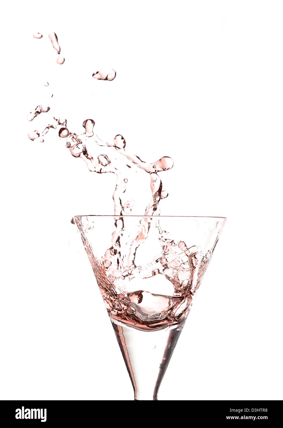 Splashing glass of red wine on a white background Stock Photo