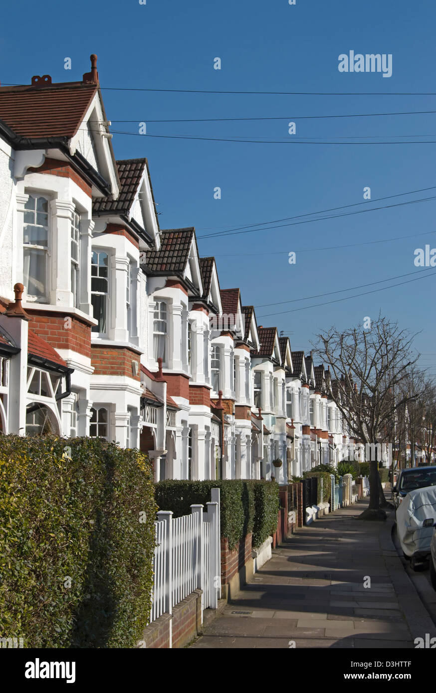 row of terraced victorian houses with bay windows in bedford park