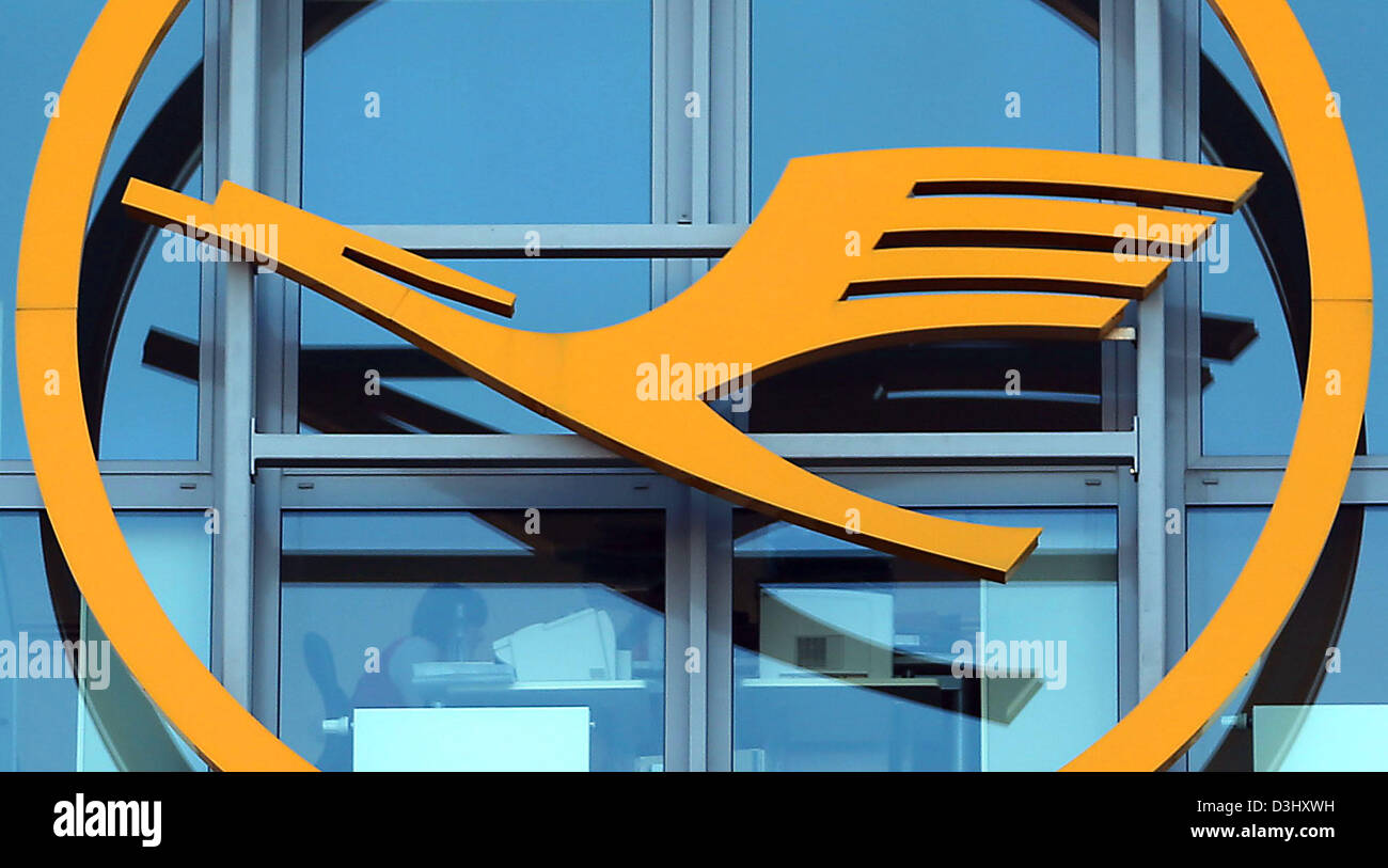 The Lufthansa logo hangs on the entrance of the airline's headquarters in Cologne, Germany, 20 February 2013. Reports state, that in the course of its austerity programme, Lufthansa will shut down its head office in Cologne and the Schleswig-Holstein department of a subsidiary in Norderstedt. Photo: OLIVER BERG Stock Photo