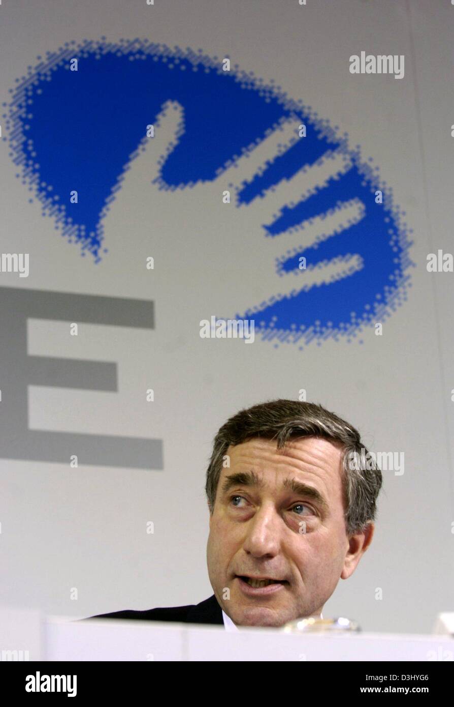 (dpa) - Harry Roels, chairman of German energy supplier RWE, smiles as he attends the balance press conference in Essen, Germany, 26 February 2004. The company announced that it wants to increase its business results and dividends within the coming years and that the surplus is expected to increase by a two-digit percentage number. RWE also announced further cost saving measures. T Stock Photo