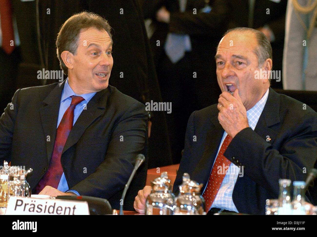 (dpa) - British Prime Minister Tony Blair (L) and French President Jacques Chirac (R) chat ahead of the EU 'Big Three' summit in Berlin, 18 February 2004. Apart from discussing future moves in the European Union, the three leaders from Germany, Britain and France hope to lay aside divisions caused by the Iraq war and to talk up Europe's fragile economy. The one-day summit hosted by Stock Photo