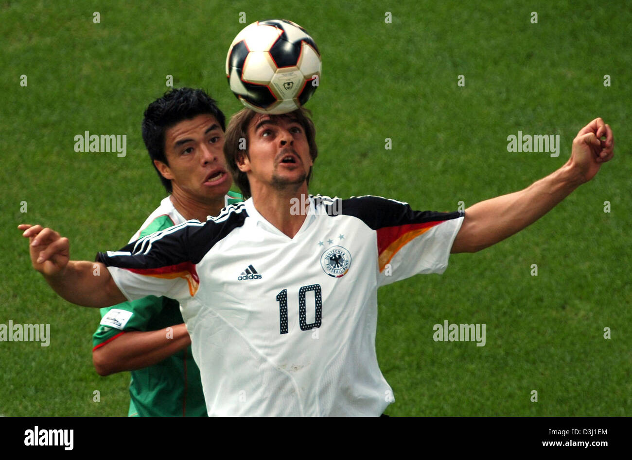 (dpa) - German soccer player Sebastian Deisler (front) fights for the ball with Mexican Ricardo Osorio (back) during the third place match of the Confederations Cup tournament Germany vs Mexico in Leipzig, Germany, 29 June 2005. (Eds: Internet use and mobile applications subject to FIFA's terms and conditions) Stock Photo