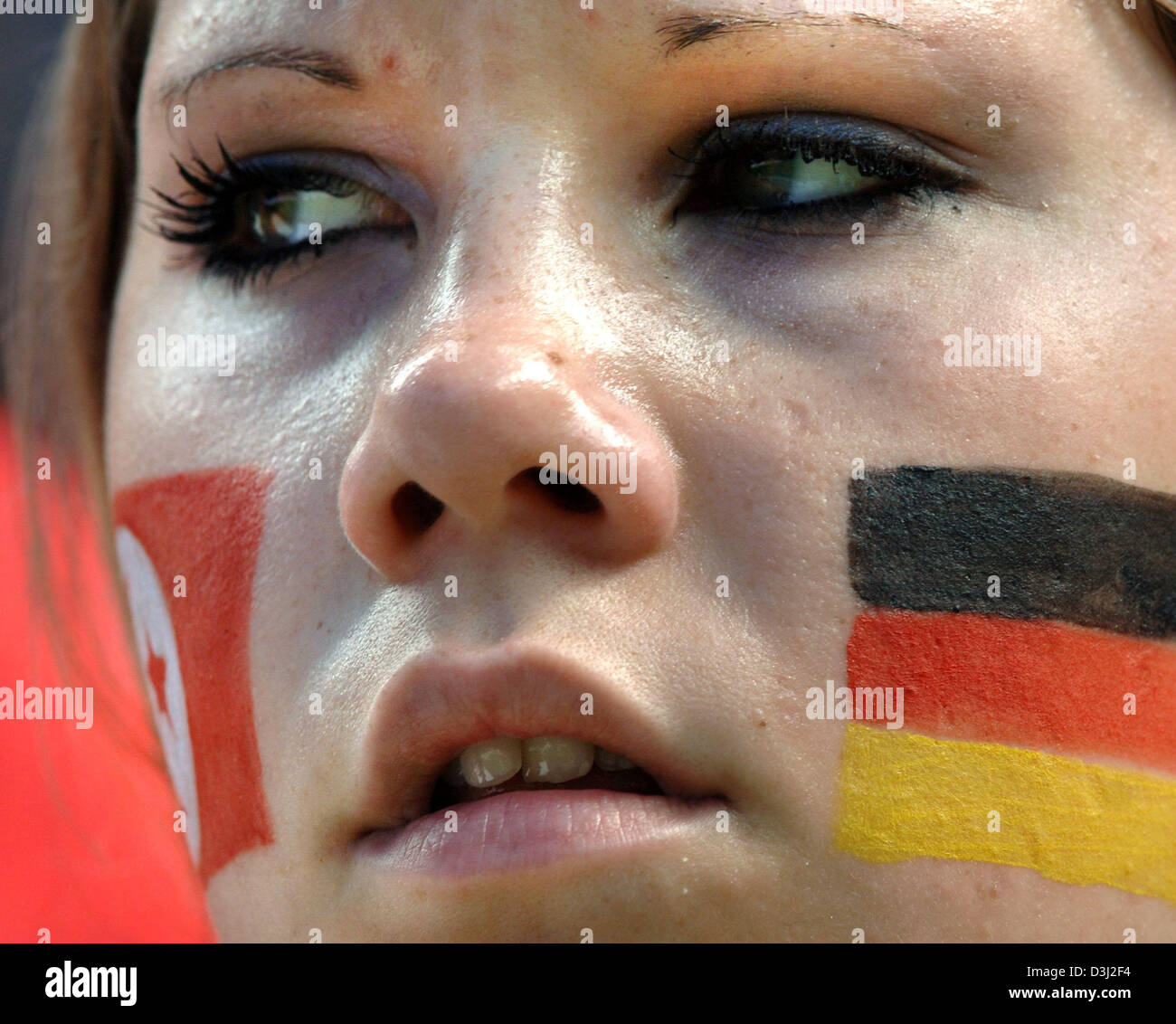 (dpa) - A German supporter watches the soccer teams prior to the group A match of the FIFA Confederations Cup tournament Tunisia - Germany in Cologne, Germany, 18 June 2005. Stock Photo