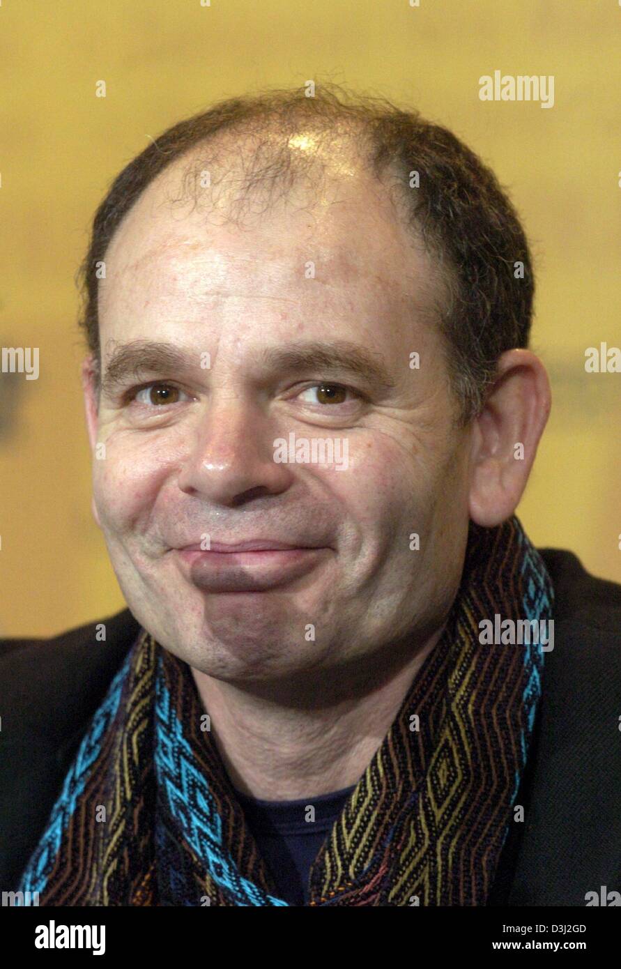 (dpa) - French actor Jean-Pierre Darroussin smiles as he attends  a press conference at the 54th Berlinale International Film Festival in Berlin, 10 February 2004.  Darroussin presented his new film 'Feux rouges' (Rear Lights). Stock Photo