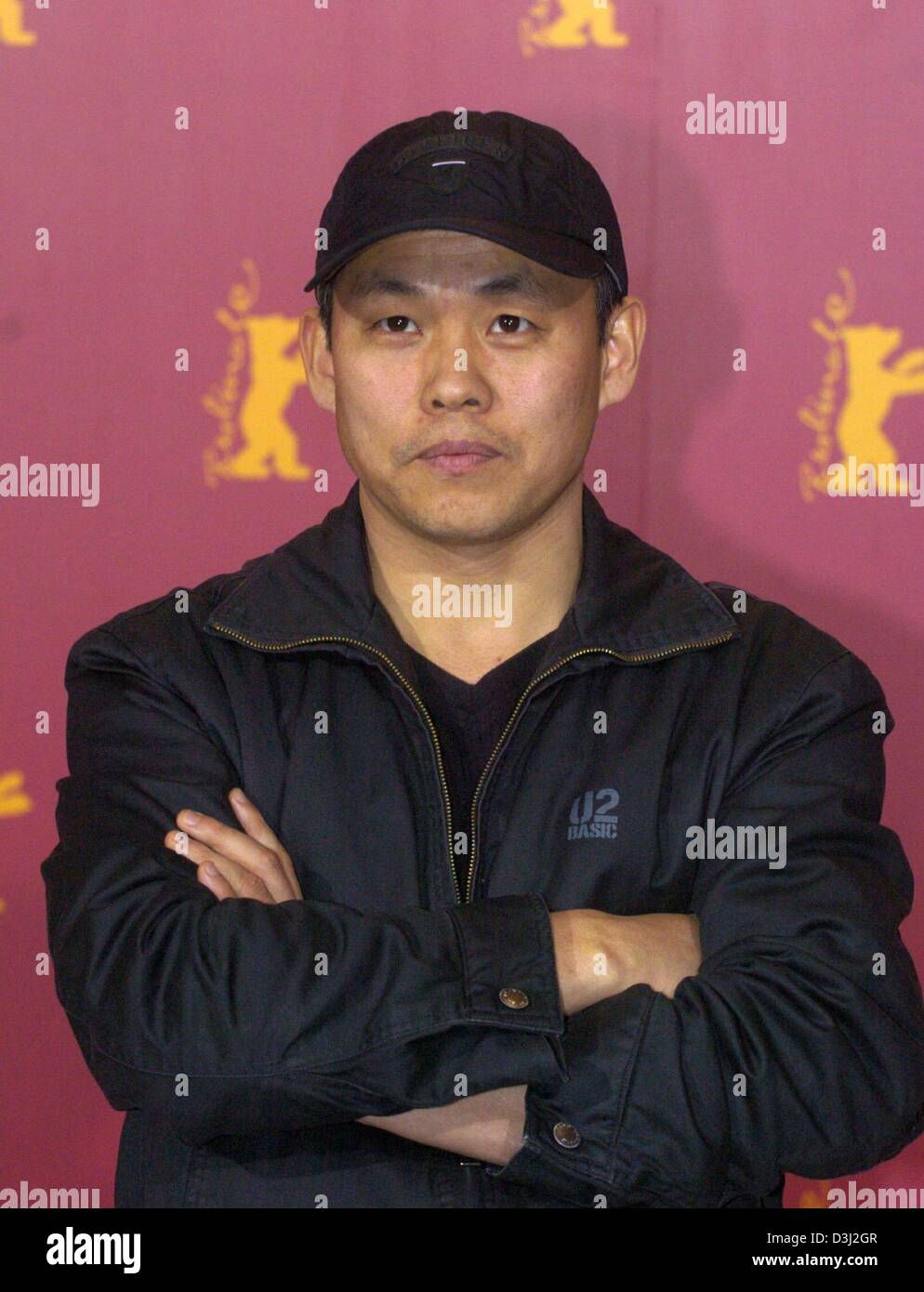 (dpa) - South Korean director Kim Ki-Duk stands with folded arms at a press conference  during the 54th Berlinale International Film Festival in Berlin, 10 February 2004. Kim Ki-Duk was awarded for his film 'Samaria'. Stock Photo