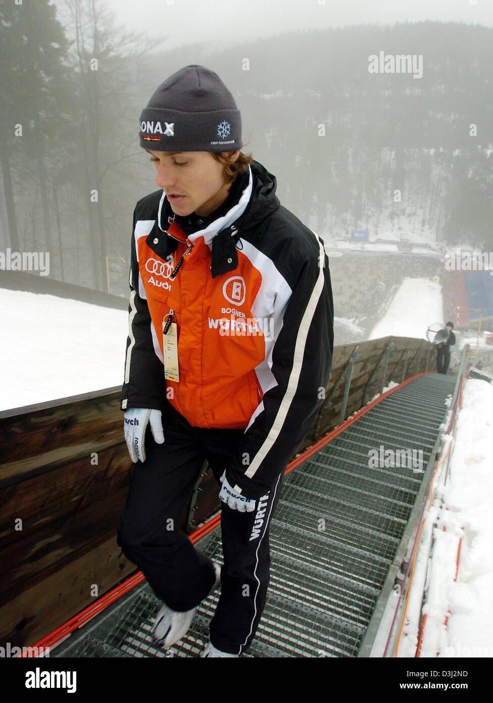 (dpa) German ski jumping ace Sven Hannawald walks up the stairs of the Muehlenkopfschanze jumping hill in Willingen, Germany on Friday 13 Februaray, 2004. Hannwald has to qualify for the upcoming Ski Jumping World Cup on Saturday 14 February 2004. It's  his first appearance  after a weeklong break. Stock Photo