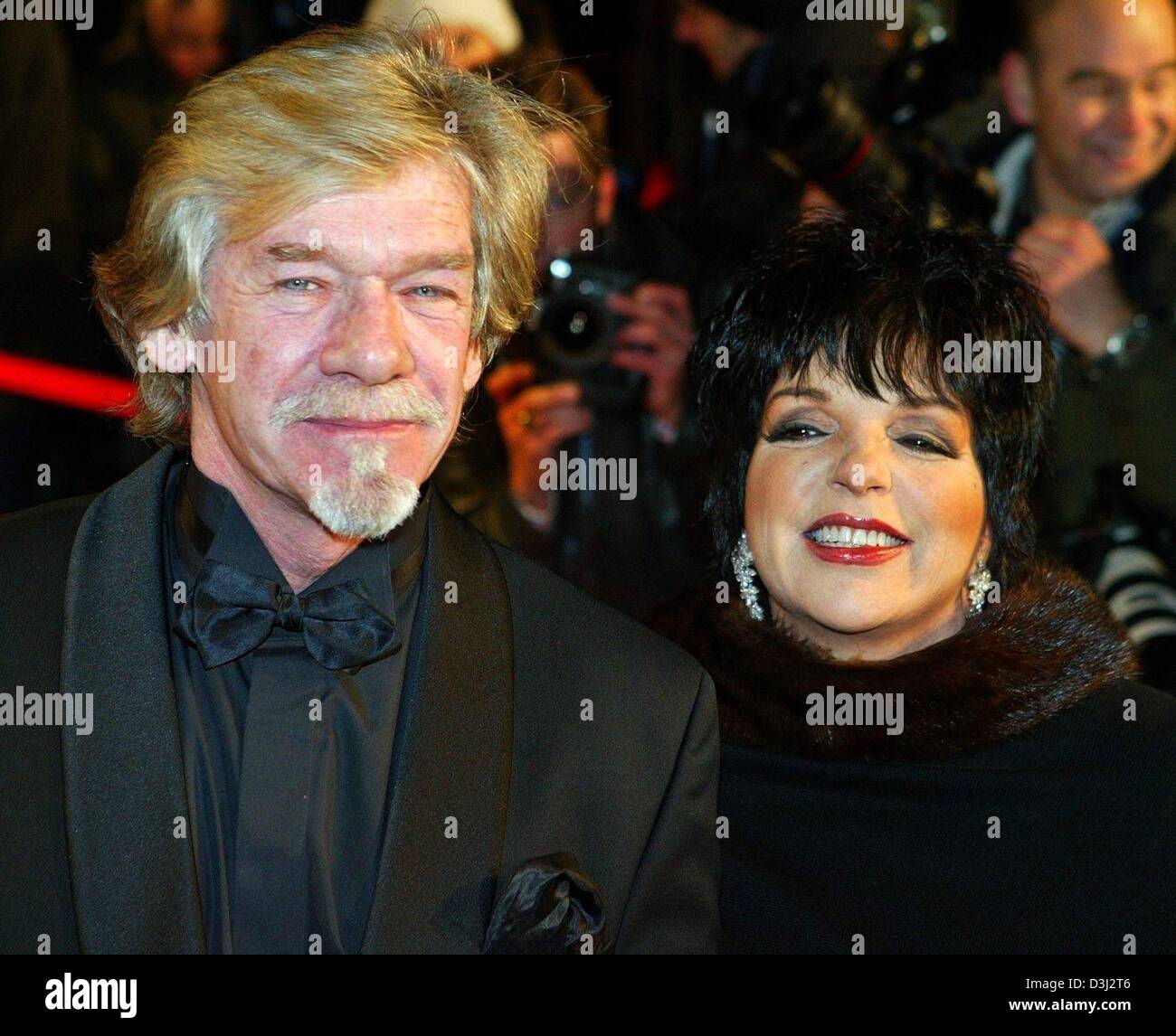Entertainer Liza Minelli and French music producer Pierre Biolon arrive to the 'Cinema for Peace' charity gala in Berlin, 9 February 2004. The proceeds of the gala, which was held on the sidelines of the Berlinale Film Festival, will go to UNICEF and Aids research institutions. Stock Photo