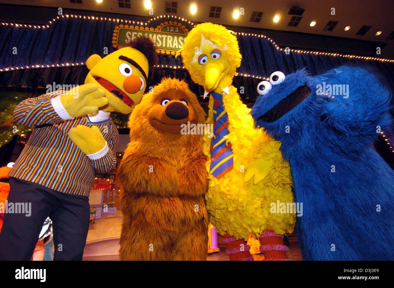 (dpa) - From L: Bert, Samson, Fibo and the cookie monster of the 'Sesame Street' ('Sesamstrasse') answers journalists' questions during a press conference in Hamburg, 8 January 2004. Together with other muppets from the TV show they will tour Germany with the live musical 'Sei mein Freund' (be my friend), making station stops in about 40 cities. Stock Photo
