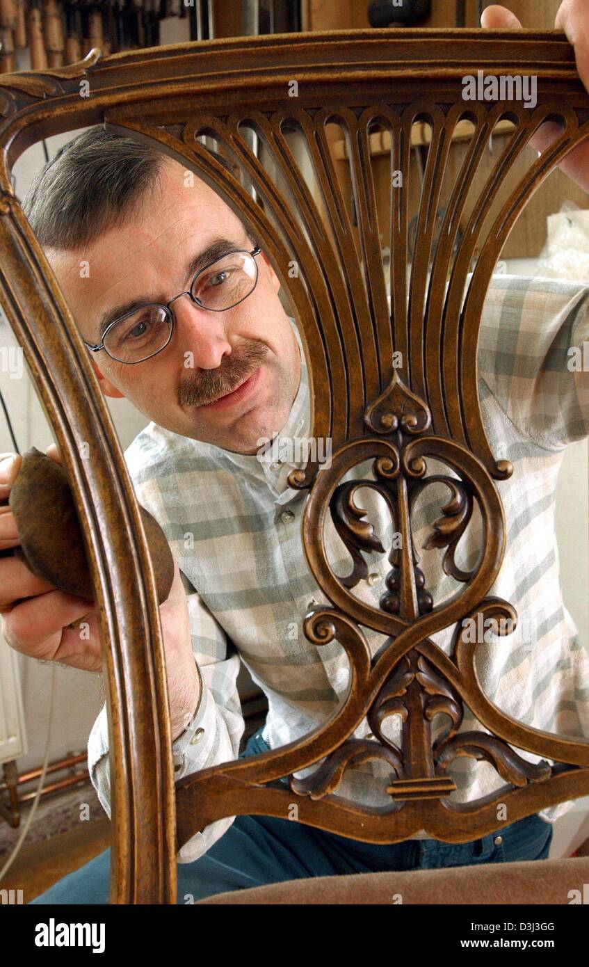 (dpa) - Furniture restorer Henry Flach works on a Chippendale chair in his workshop in Auma, Germany, 20 October 2003. Stock Photo