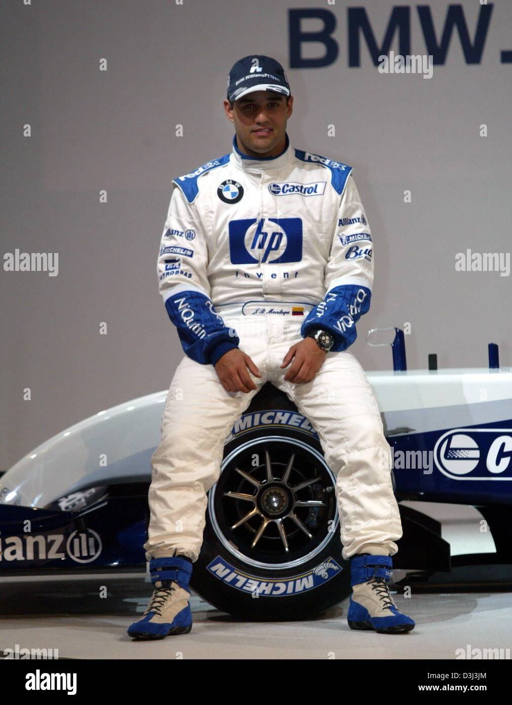 (dpa) - Colombian formula one pilot Juan Pablo Montoya sits on the new BMW-Williams FW26 racing car for the upcoming season during its presentation in Valencia, Spain, 5 January 2004. The car has a new aerodynamic concept and a new motor. The FW26 will be intensively tested in Jerez, Spain, as of 7 January 2004. Stock Photo