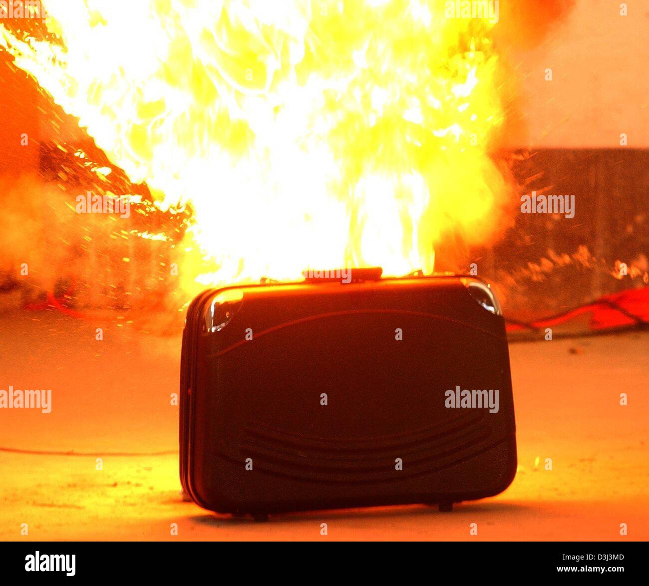(dpa) - A suitcase explodes during an exercise of the technical special squad (TSG) of the Bavarian state police in Neubiberg, Germany, 21 November 2003. The special squad exists since 1974 and is deployed in missions to defuse and eliminate explosives and incendiary compositions. Stock Photo