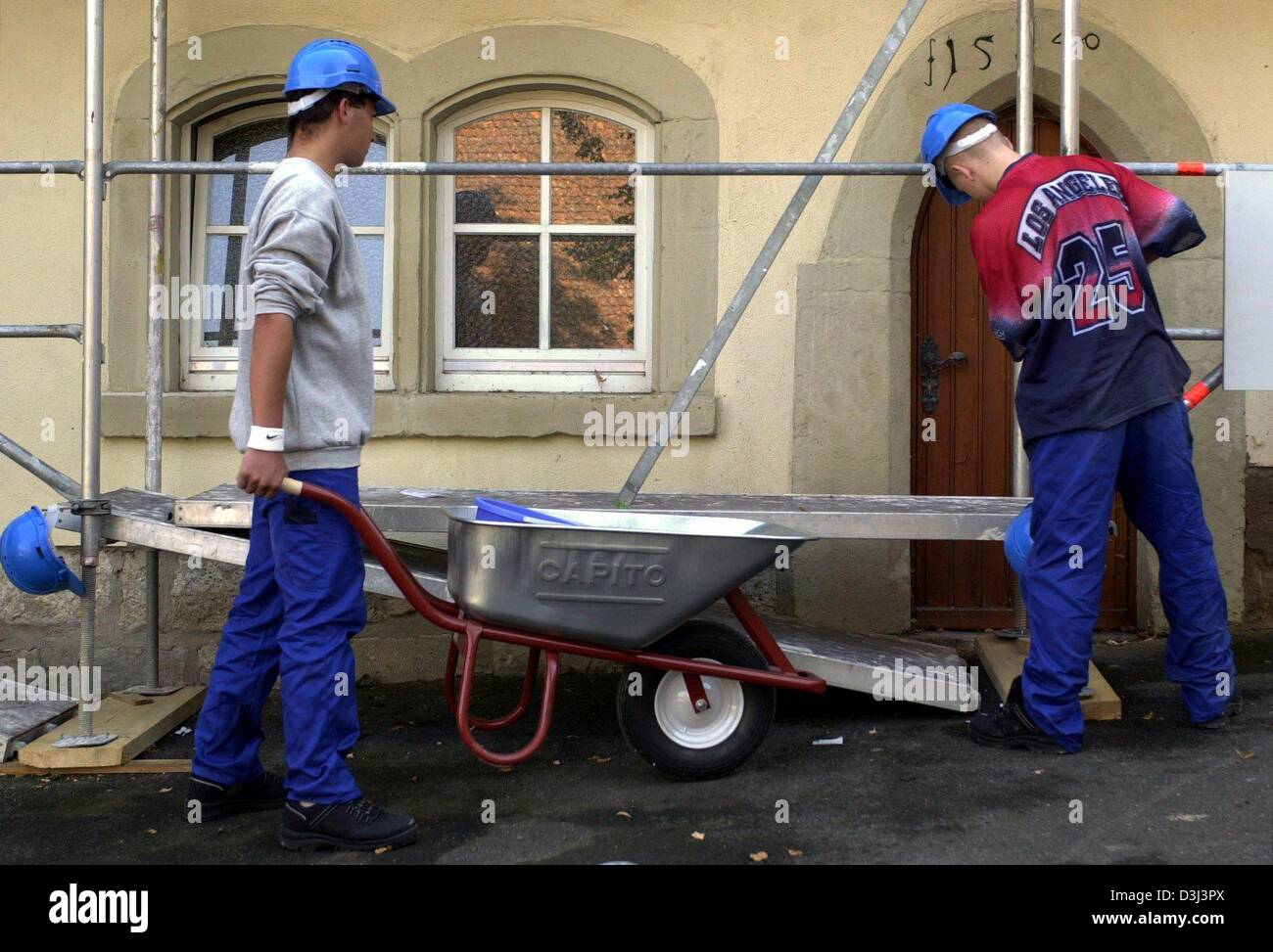(dpa) - Two juvenile detainees participate in the renovation of the Frauental monastery as part of the rehabilitation project 'Projekt Chance' in Creglingen, Germany, 22 September 2003. The Christliche Jugendorfwerk Deutschland e. V. (CJD), a church related association concerned with the problems, support and rehabilitation of youths, initiated 'Projekt Chance' as a German pilot pr Stock Photo