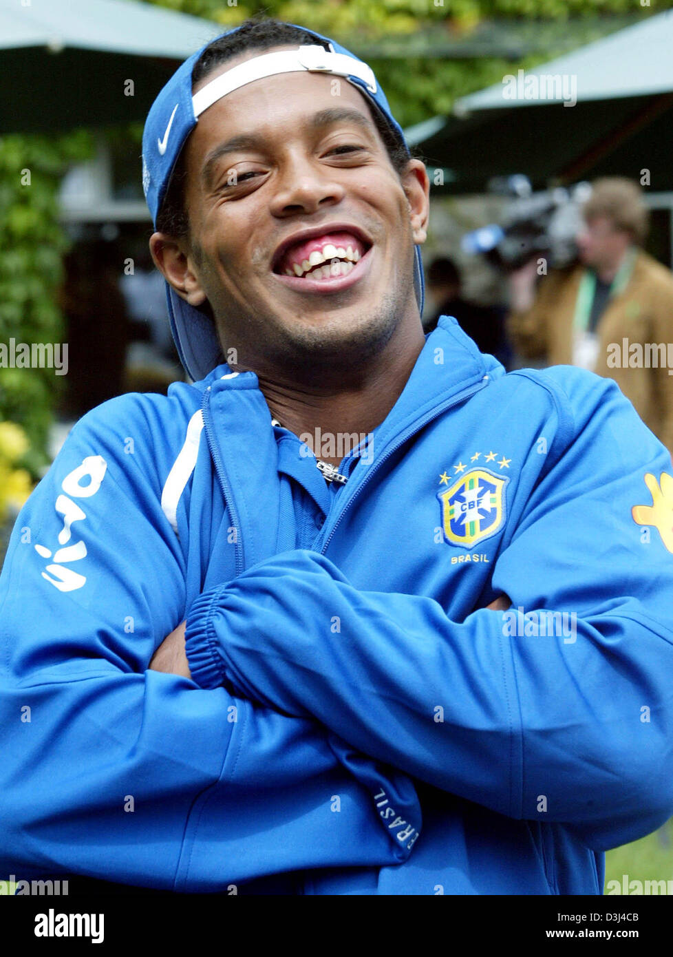 (dpa) - Brazilian star soccer player Ronaldinho smiles as he stands in front of the 'Schloss Lerbach' hotel, which accommodates the Brazilian national soccer team, in Bergisch Gladbach, Germany, Tuesday, 14 June 2005. The Brazilian team prepares for their first match of the 2005 Confederations Cup. Stock Photo
