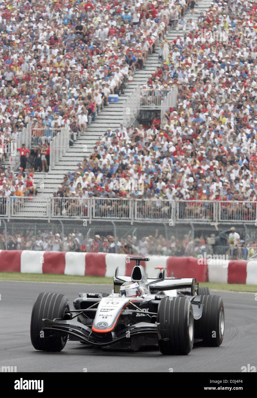 (dpa) - The picture shows Colombian Formula One driver Juan Pablo Montoya of McLaren after the start of the F1 Grand Prix of Canada at the Canadian race track Gilles Villeneuve in Montreal, Canada, 12 June 2005. Stock Photo