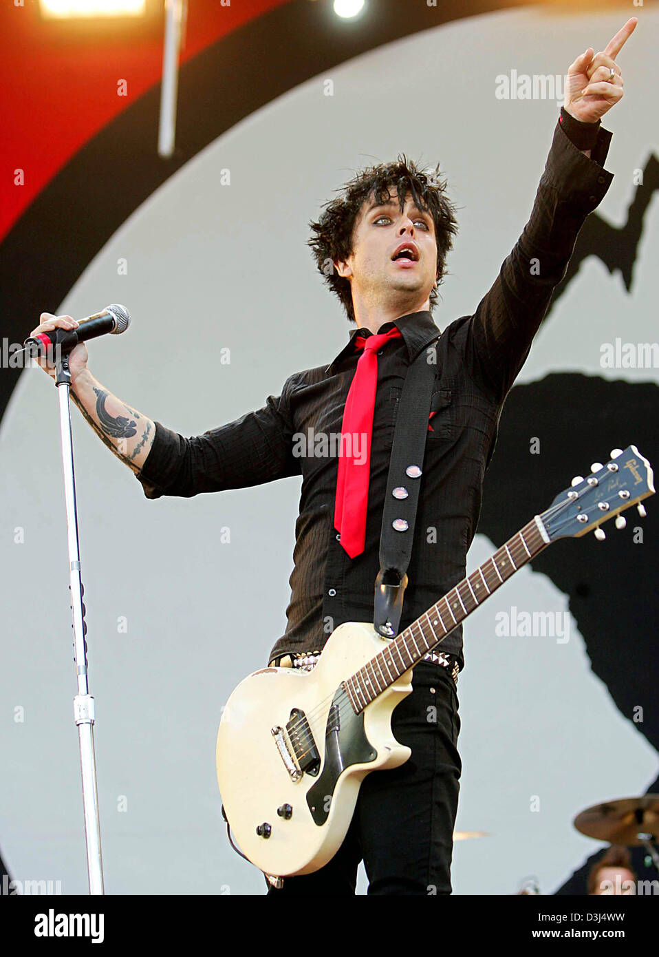 (dpa) - Singer Billie Joe Armstrong of the US American band Green Day  performs on the 'centerstage' in Nuremberg, Germany, Saturday 04 June 2005. This weekend the German rock scene will be drawn to the Eifel and Franconia. The twin music festivals in Nuremberg and at the Nuerburgring boast more than 90 German and international bands featuring the whole  spectrum of rock until its  Stock Photo