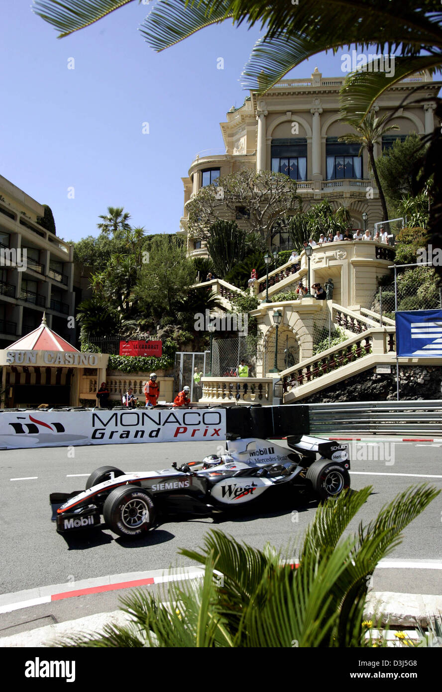 (dpa) - Colombian Formula One driver Juan Pablo Montoya of McLaren Mercedes in action in front of Sun Casino and Grand Hotel during the first practice session for the Monaco Grand Prix in Monte Carlo, Monaco, 19 May 2005. Stock Photo