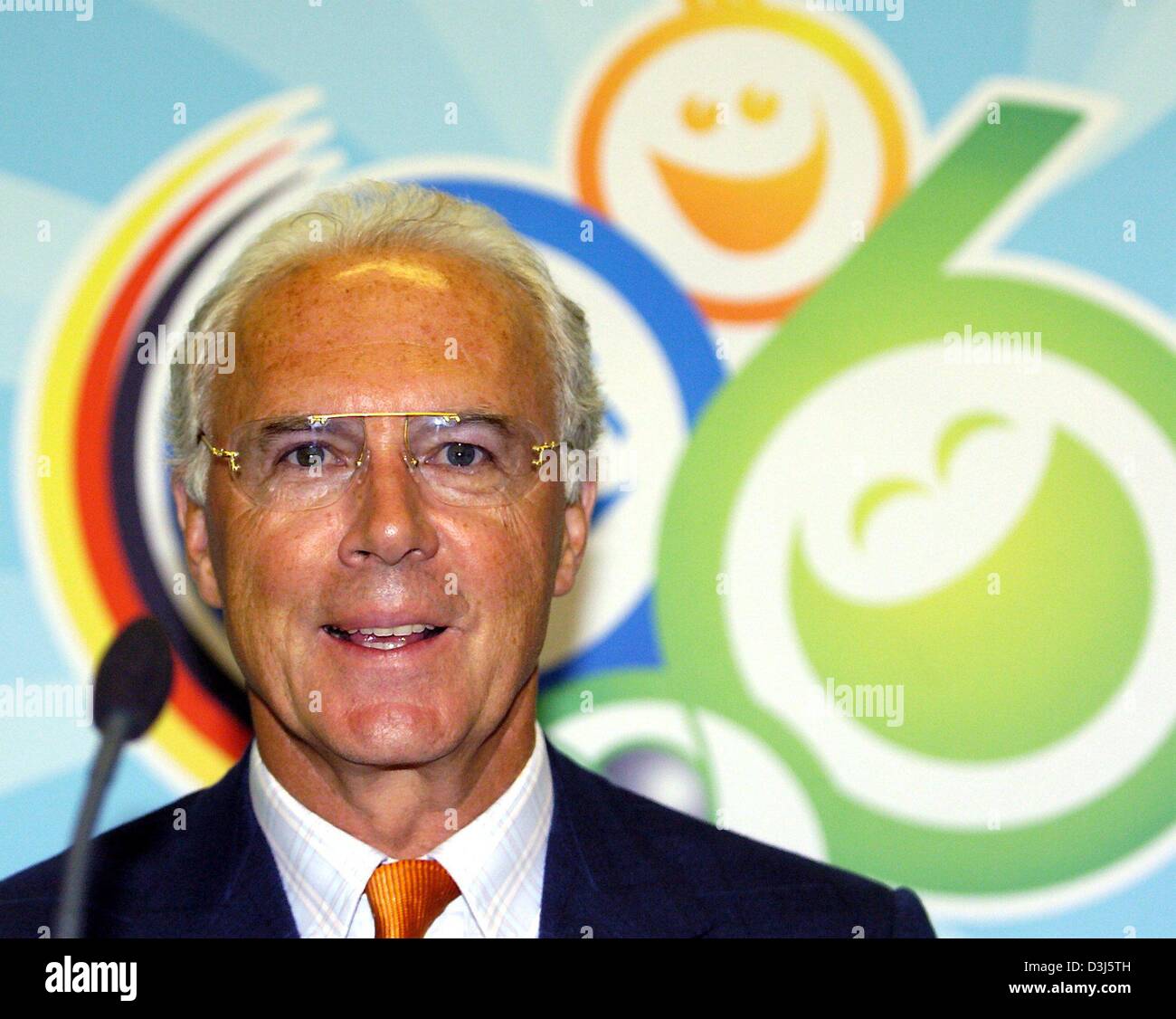 (dpa) - Former soccer star Franz Beckenbauer from Germany speaks as President of the organizing comitee about the next soccer FIFA World Cup to be held in Germany in 2006, in Basel, Switzerland, 2 June 2004, prior to a pre Euro2004 friendly match between Germany and Switzerland. In the background the logo for the 2006 World Cup. Stock Photo