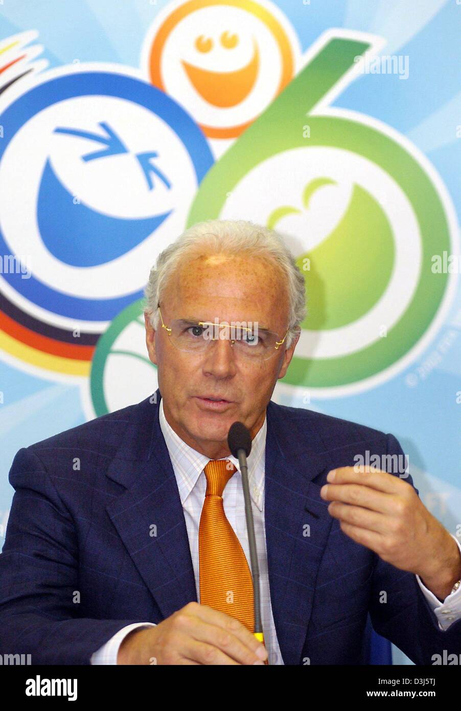 (dpa) - Former soccer star Franz Beckenbauer from Germany speaks as President of the organizing committee about the next soccer FIFA World Cup to be held in Germany in 2006, in Basel, Switzerland, 2 June 2004, prior to a pre Euro2004 friendly match between Germany and Switzerland. In the background the logo for the 2006 World Cup. Stock Photo