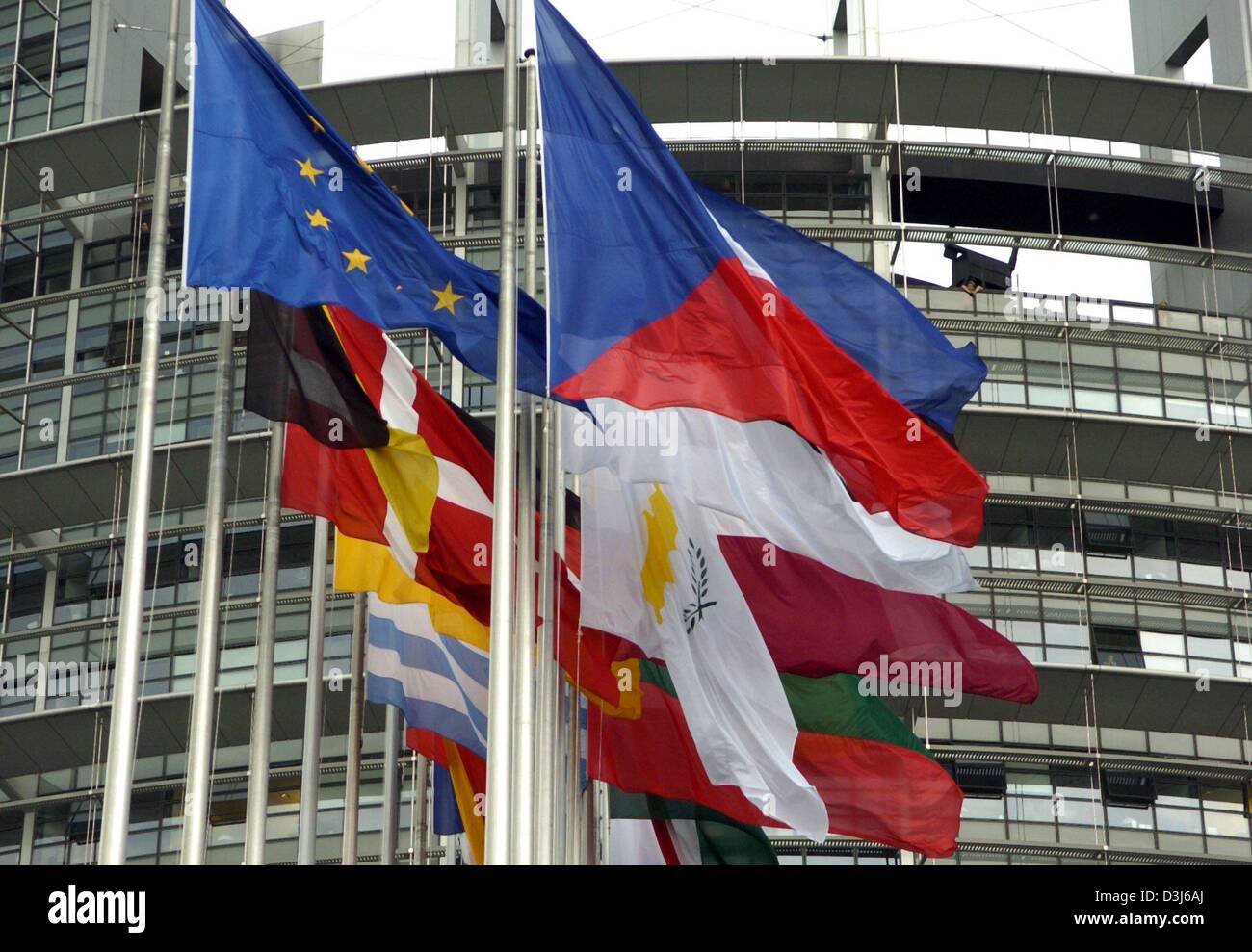 (dpa) - The flags of the new members of the European Union (R, Czech Republic in front) flutter next to the flags of the old EU members (L, European flag in front) in front of the European Parliament in Strasbourg, France, 3 May 2004. Stock Photo