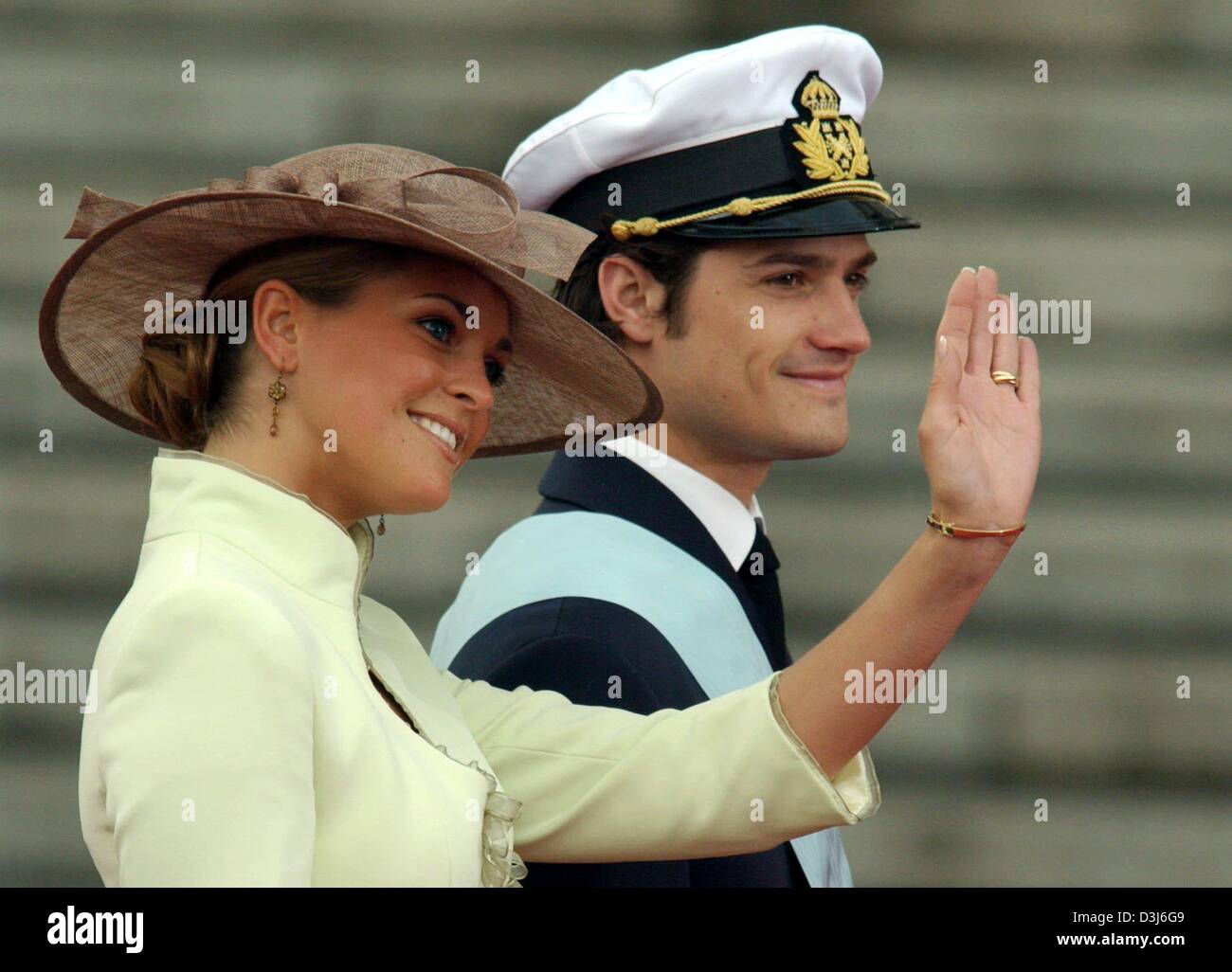 (dpa) - Princess Madeleine (L) and prince Carl Philip of Sweden smile and wave their hands as they arrive at the Almudena Cathedral for the wedding of Spanish crown prince Felipe and Letizia Ortiz in Madrid, Spain, Saturday 22 May 2004. Stock Photo