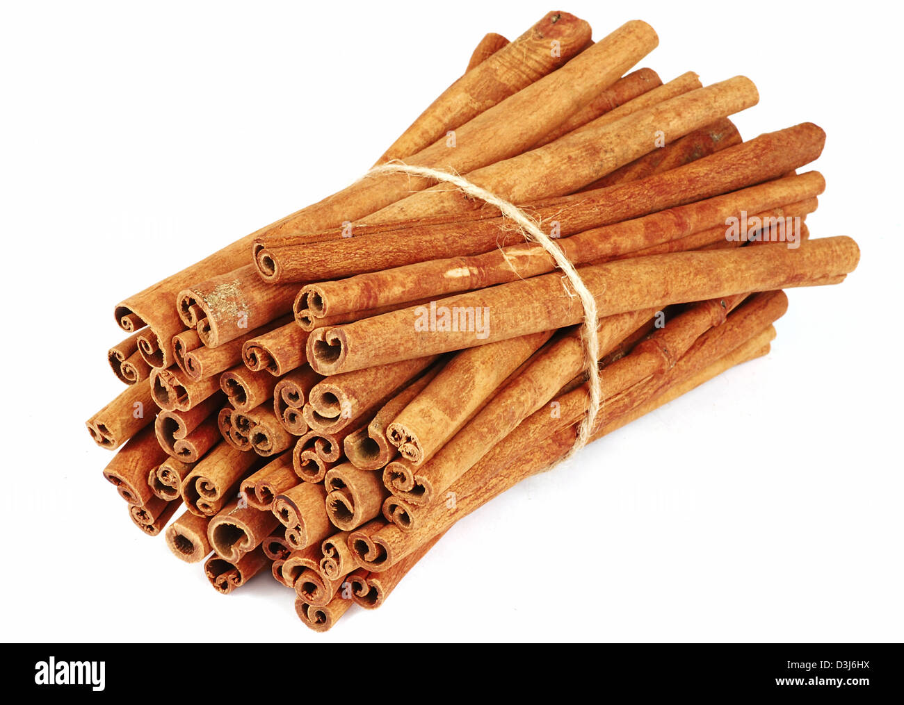 Big bundle of spicy cinnamon sticks isolated Stock Photo Alamy
