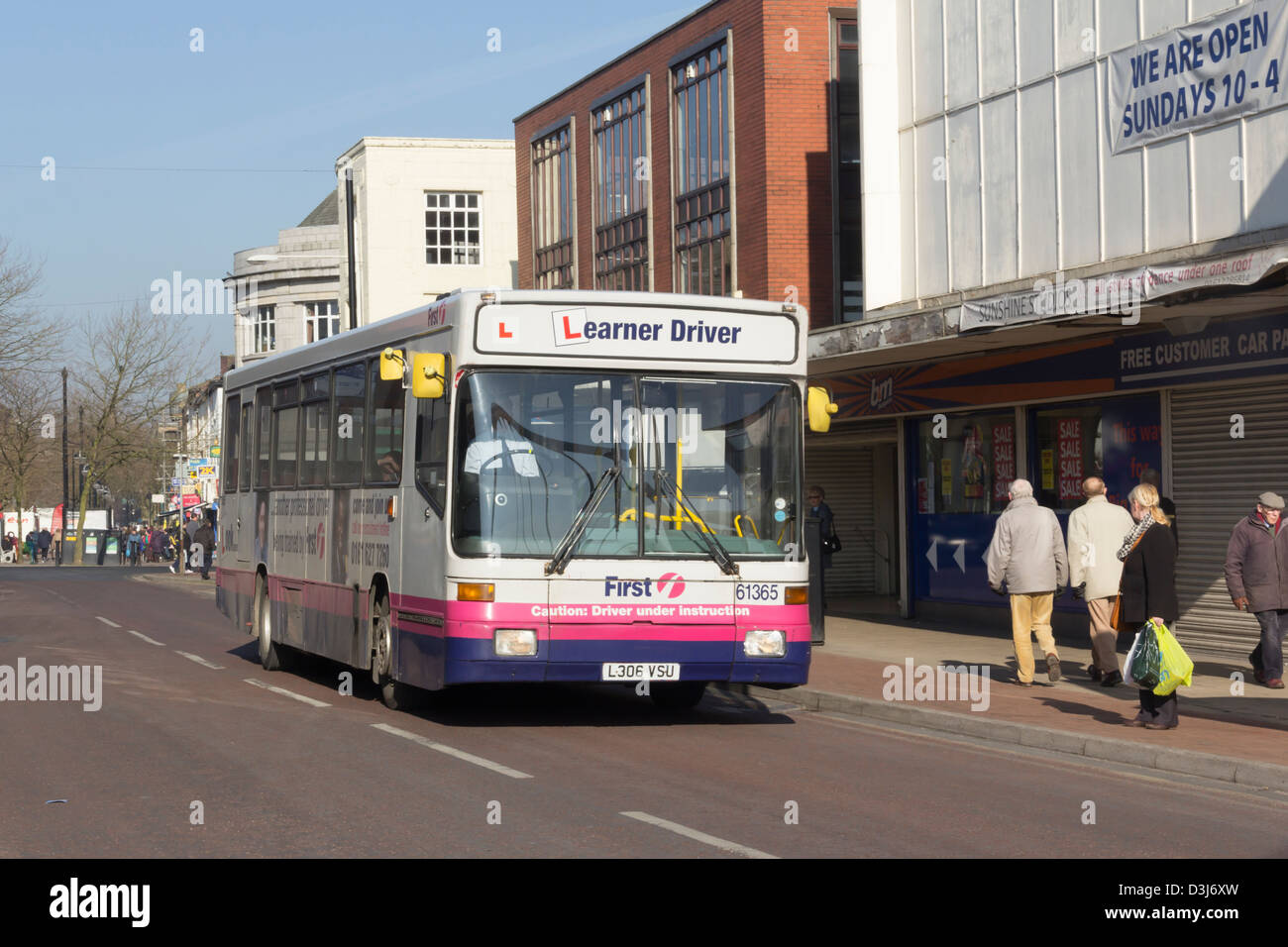 A learner driver single decker bus belonging to First Greater Manchester's bus fleet  on Newport Street in Bolton. Stock Photo