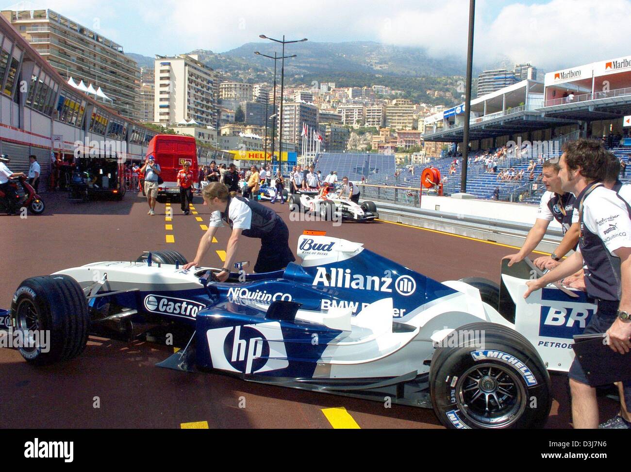 (dpa) - Mechanics of team BMW-Williams push one of their team's racecars through the new pit lane at the city course in Monaco 19 May 2004. The Formula 1 Grand Prix of Monaco will be held on Sunday, 23 May 2004. Stock Photo